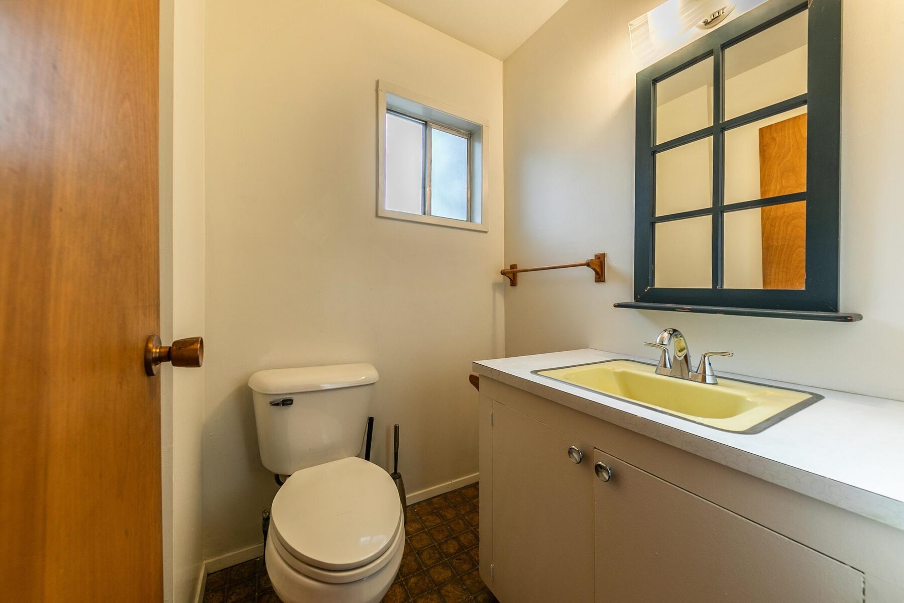 10191 Donner Trail Road Truckee, CA 96161 - Photo 11 of 21 a bathroom with a toilet a sink and a window