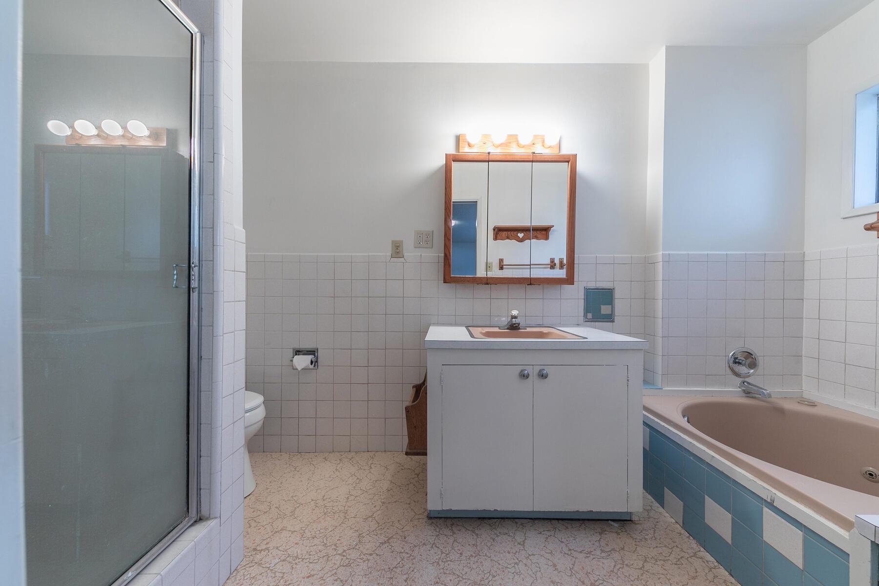 10191 Donner Trail Road Truckee, CA 96161 - Photo 13 of 21 a bathroom with a double vanity sink a toilet and mirror