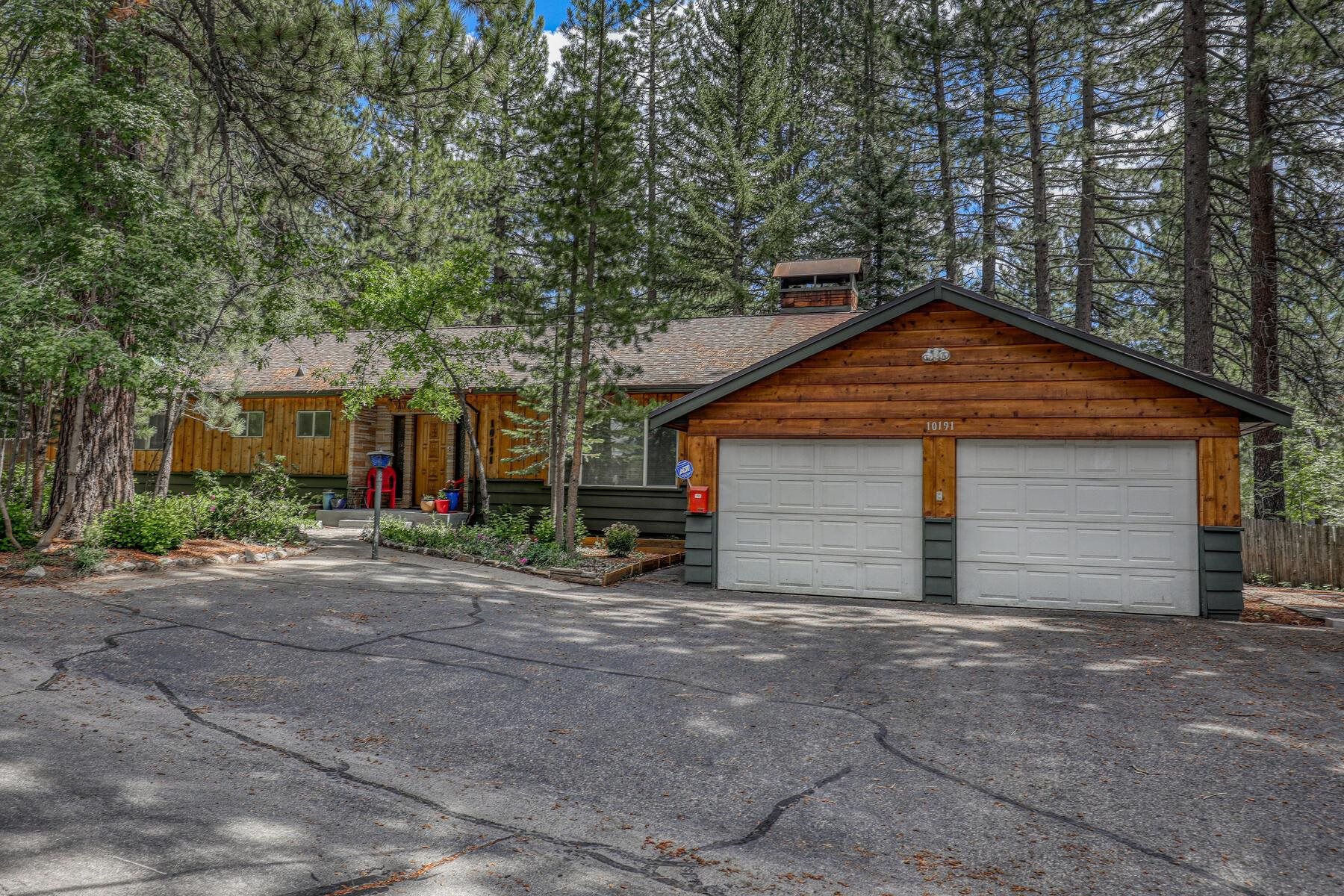 10191 Donner Trail Road Truckee, CA 96161 - Photo 21 of 21 a front view of a house with a yard and garage