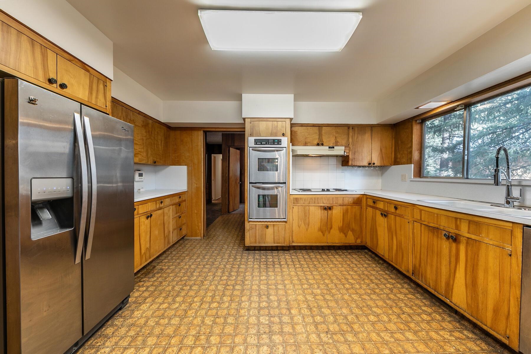 10191 Donner Trail Road Truckee, CA 96161 - Photo 6 of 21 a kitchen with stainless steel appliances a refrigerator sink and cabinets