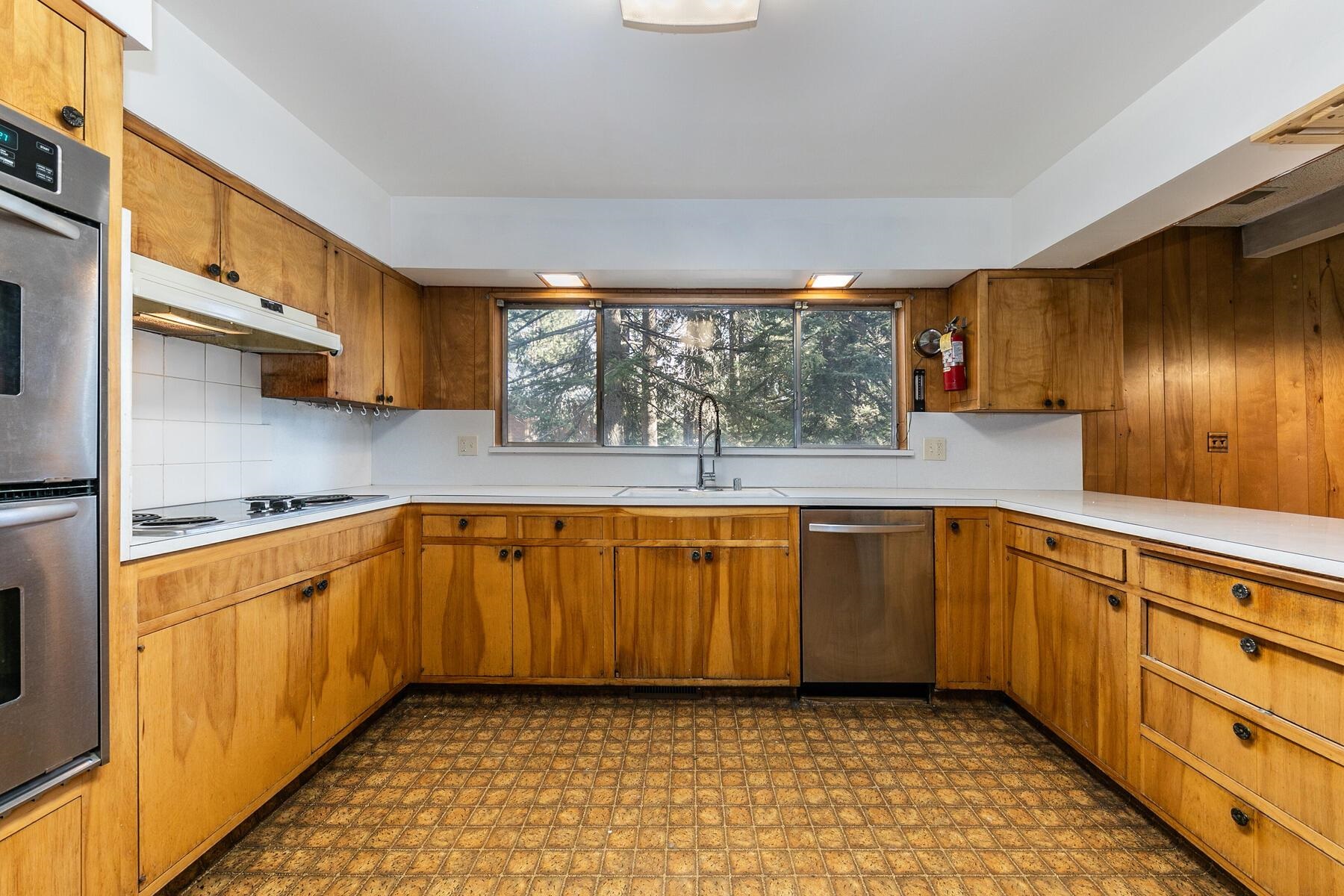 10191 Donner Trail Road Truckee, CA 96161 - Photo 7 of 21 a kitchen with stainless steel appliances granite countertop a sink and cabinets