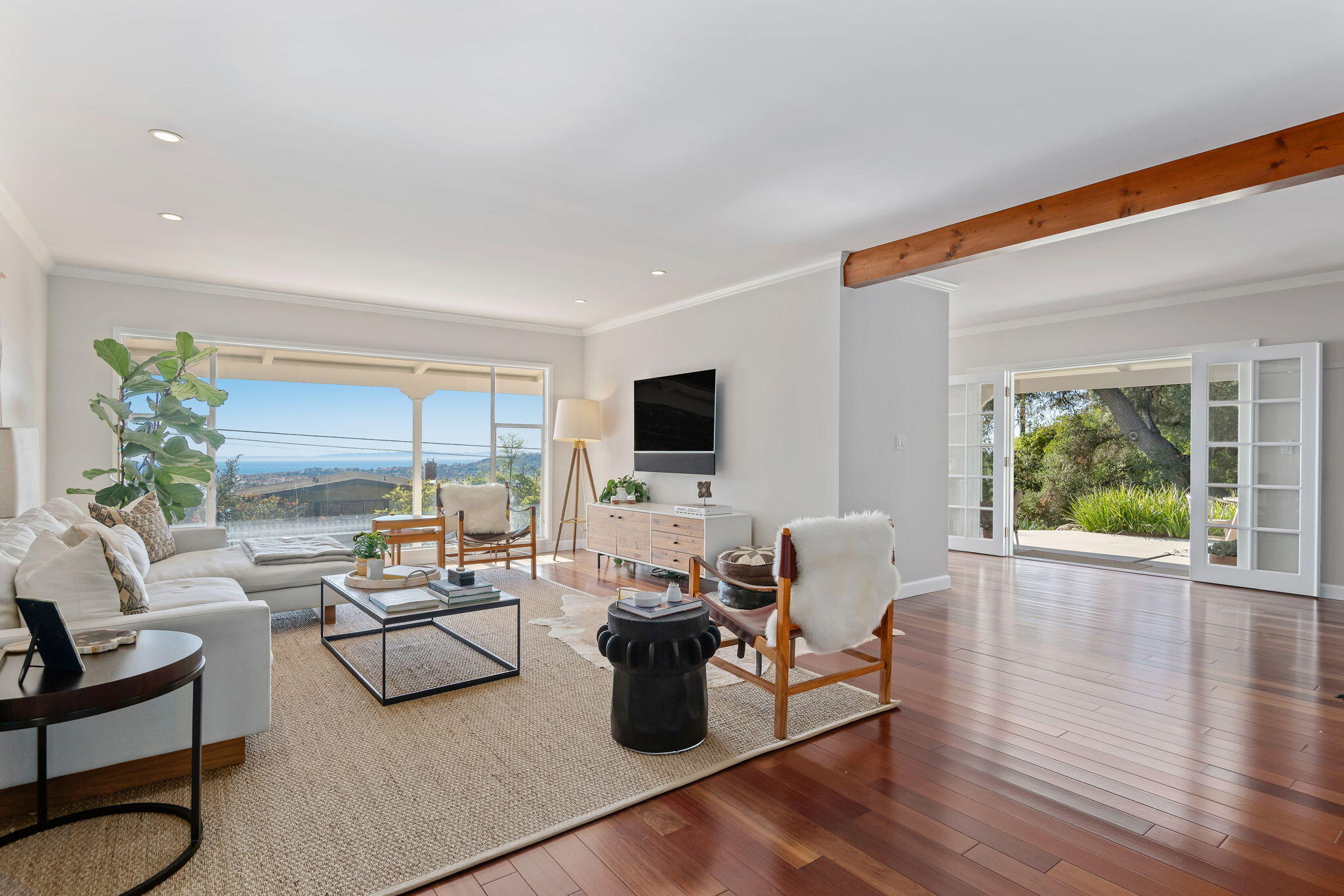 712 Arbolado Road Santa Barbara, CA 93103 - Photo 11 of 28 a living room with furniture wooden floor and a flat screen tv