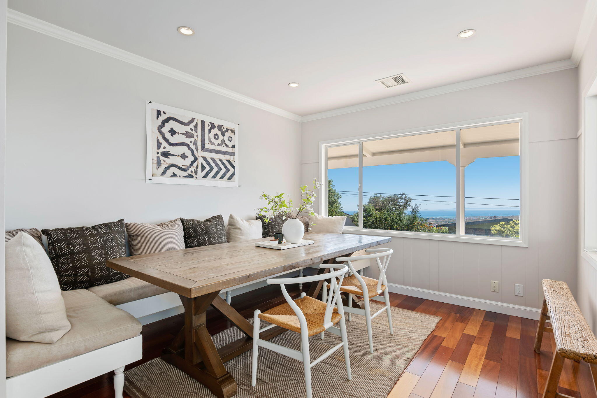 712 Arbolado Road Santa Barbara, CA 93103 - Photo 15 of 28 a view of a dining room with furniture window and wooden floor