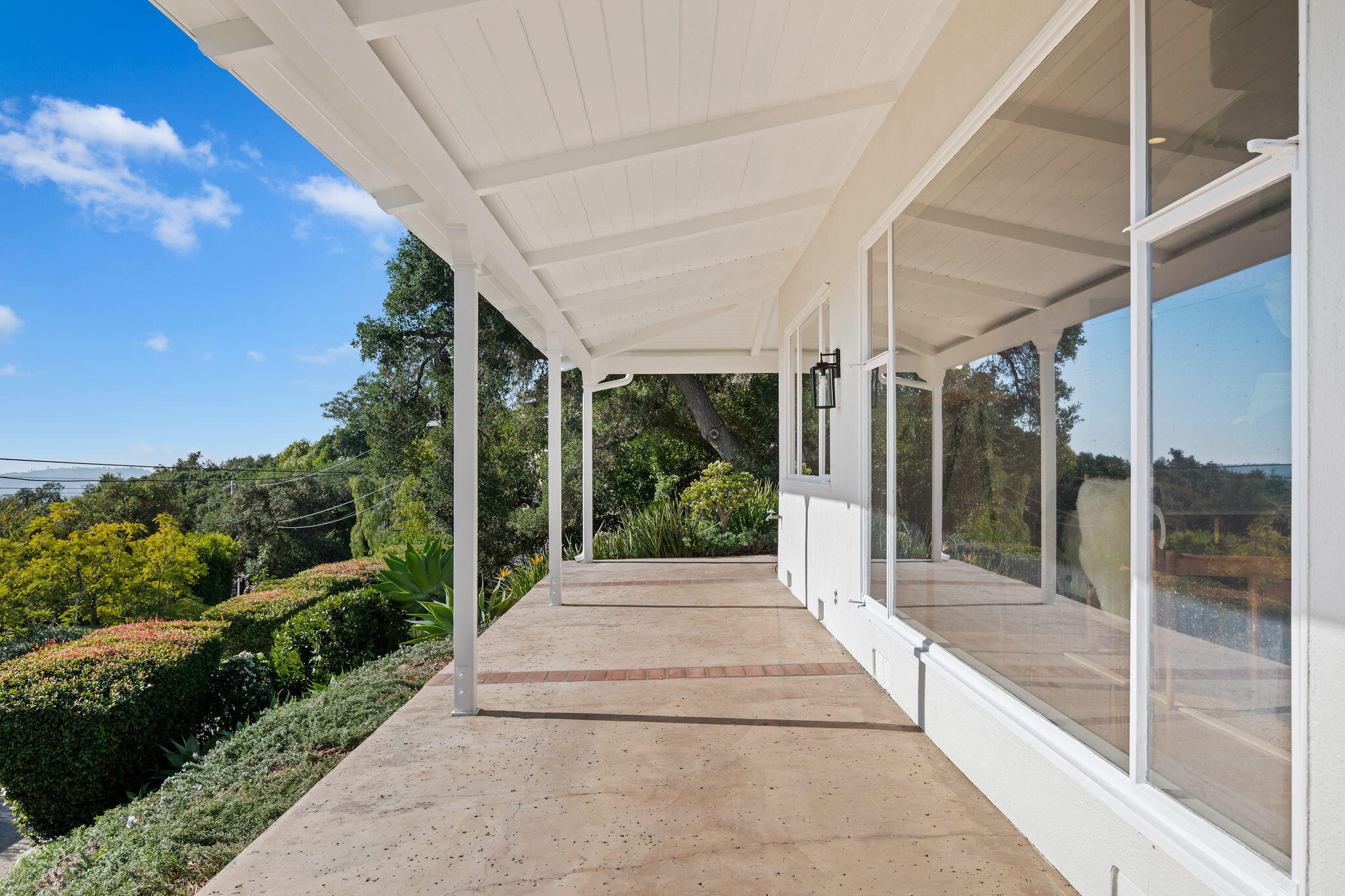 712 Arbolado Road Santa Barbara, CA 93103 - Photo 27 of 28 a porch with a table and chairs next to a yard