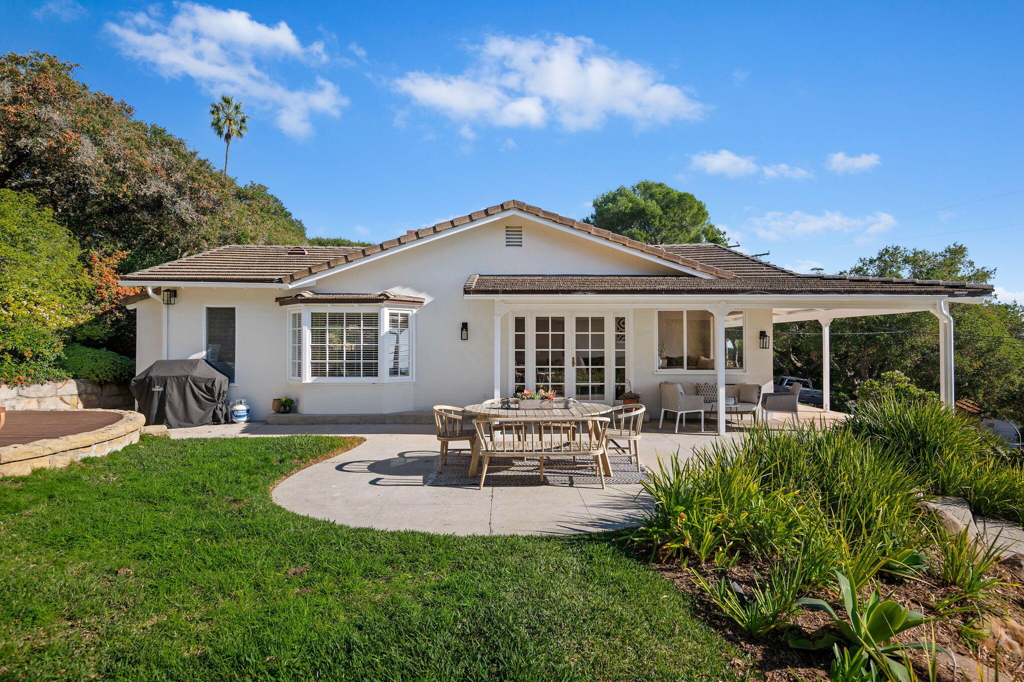 712 Arbolado Road Santa Barbara, CA 93103 - Photo 3 of 28 a front view of a house with swimming pool having outdoor seating
