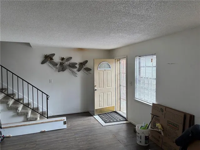 a view of livingroom with hardwood floor and a window