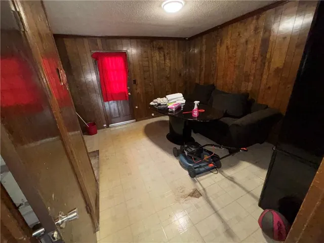 a living room with furniture and flowers