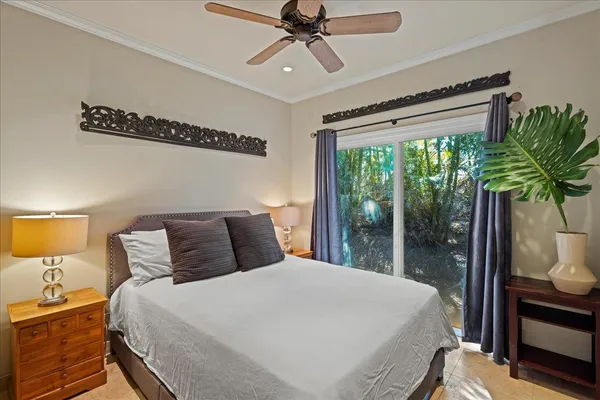 a bedroom with a large bed and a window