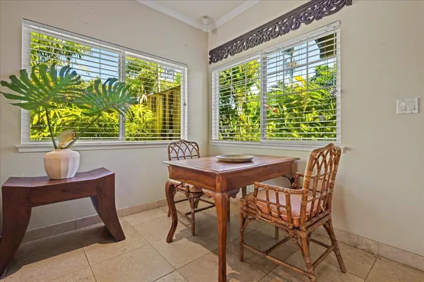 a view of a dining room with furniture window and outside view