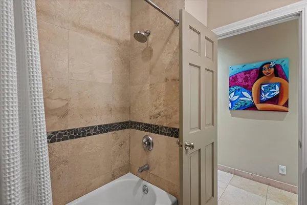 a bathroom with a shower and a sink