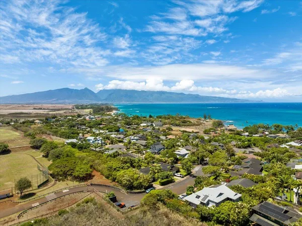 a view of an ocean and a mountain