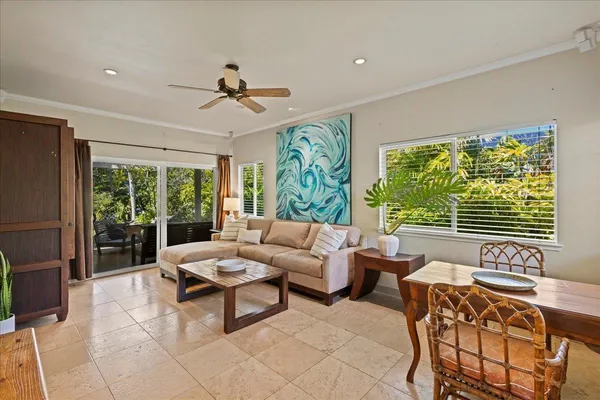 a living room with furniture and a large window
