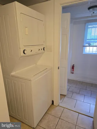 a view of a utility room with closet