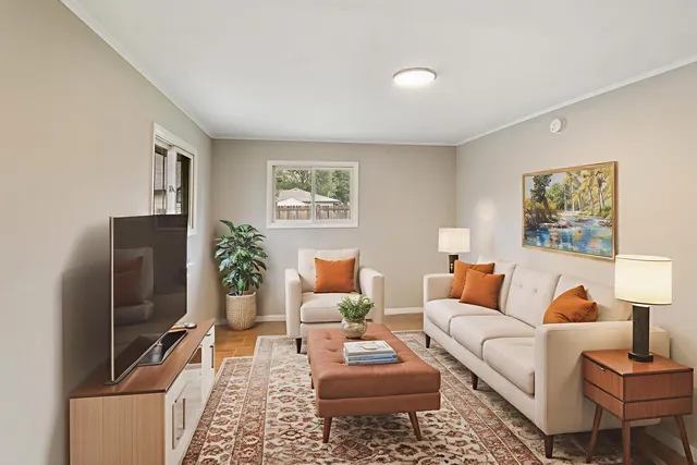 a living room with furniture and a flat screen tv