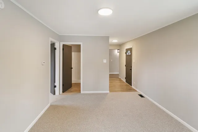 a bathroom with a toilet a sink and shower