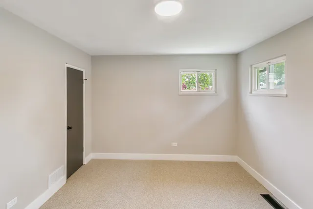 a bathroom with a shower and a sink
