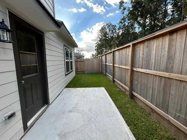 a view of backyard with green space