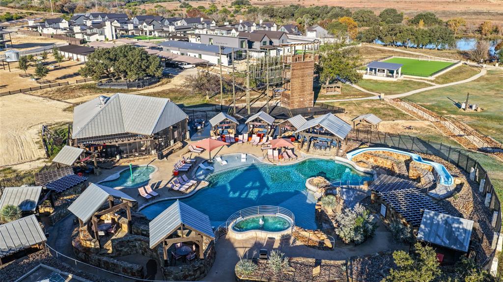 415 Emma Jean Trail Iredell, TX 76649 - Photo 12 of 15 an aerial view of a house with a swimming pool yard and outdoor seating