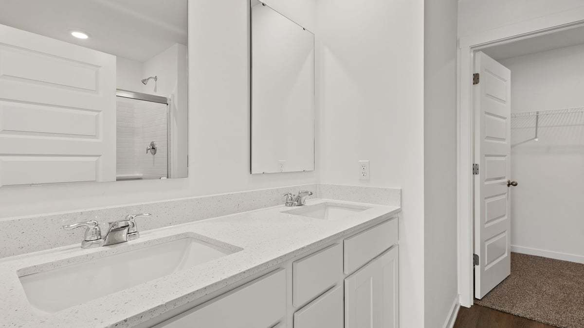 515 Adirondack Court Joliet, IL 60421 - Photo 16 of 16 a bathroom with a sink and a mirror