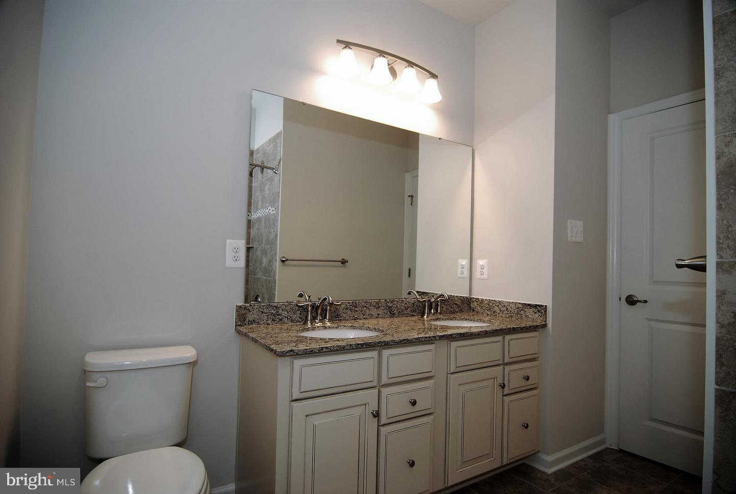 6012 Leben, Unit D Frederick, MD 21703 - Photo 15 of 18 Hall Bath with double bowl vanity