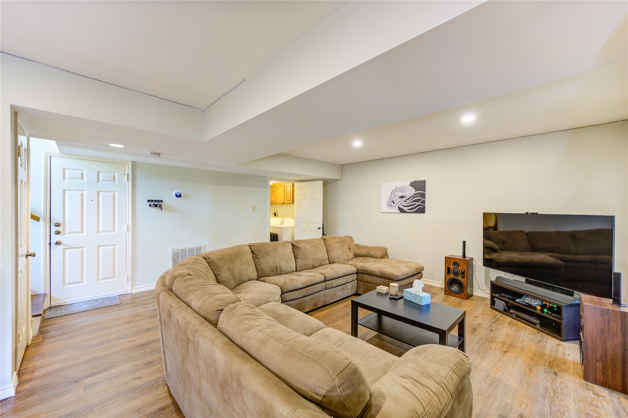 7861 Champion Pines Drive Spring, TX 77379 - Photo 19 of 34 a living room with furniture and a flat screen tv