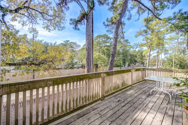 a view of balcony with wooden floor