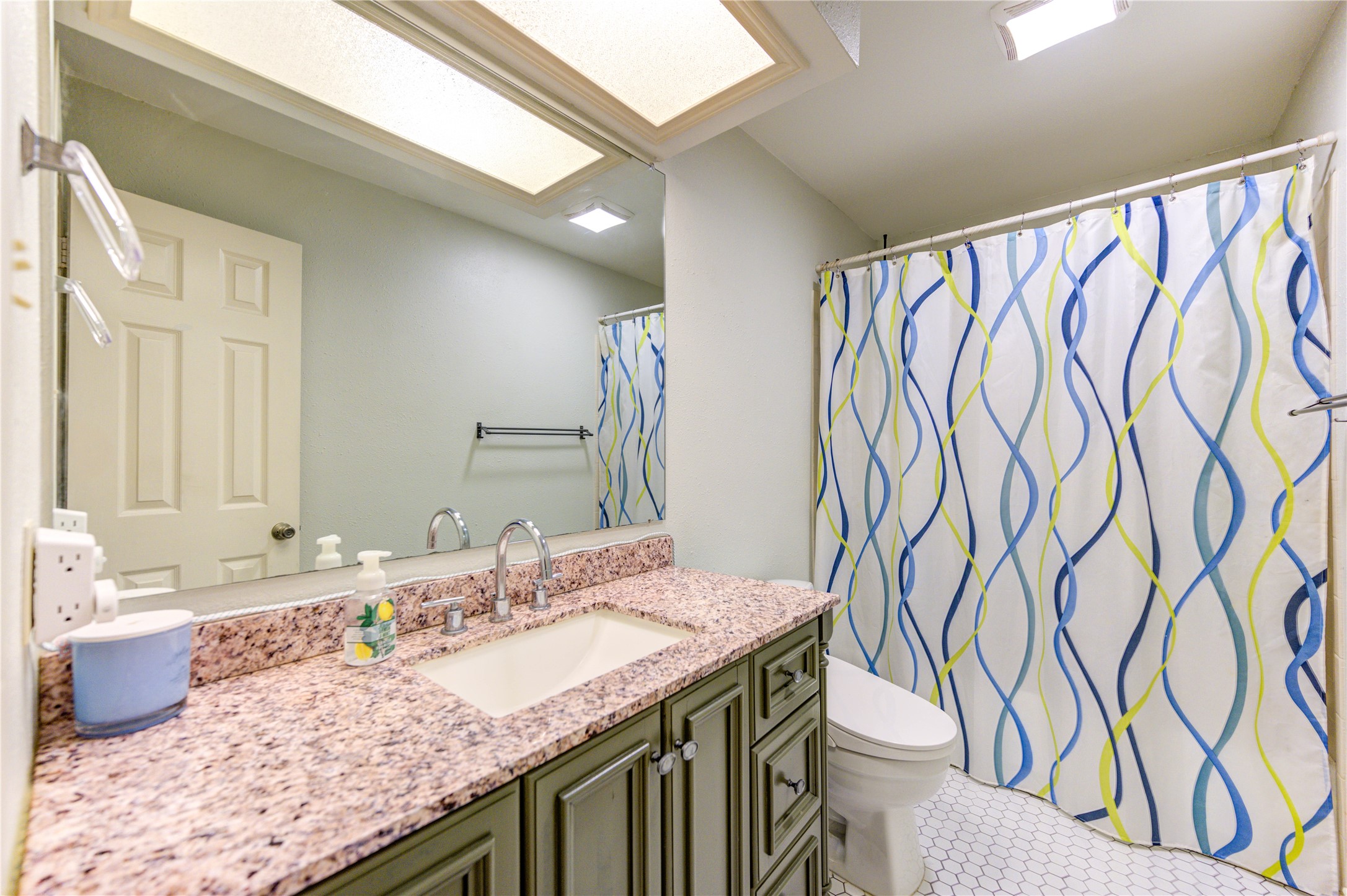 7861 Champion Pines Drive Spring, TX 77379 - Photo 23 of 34 a bathroom with a granite countertop sink and a mirror
