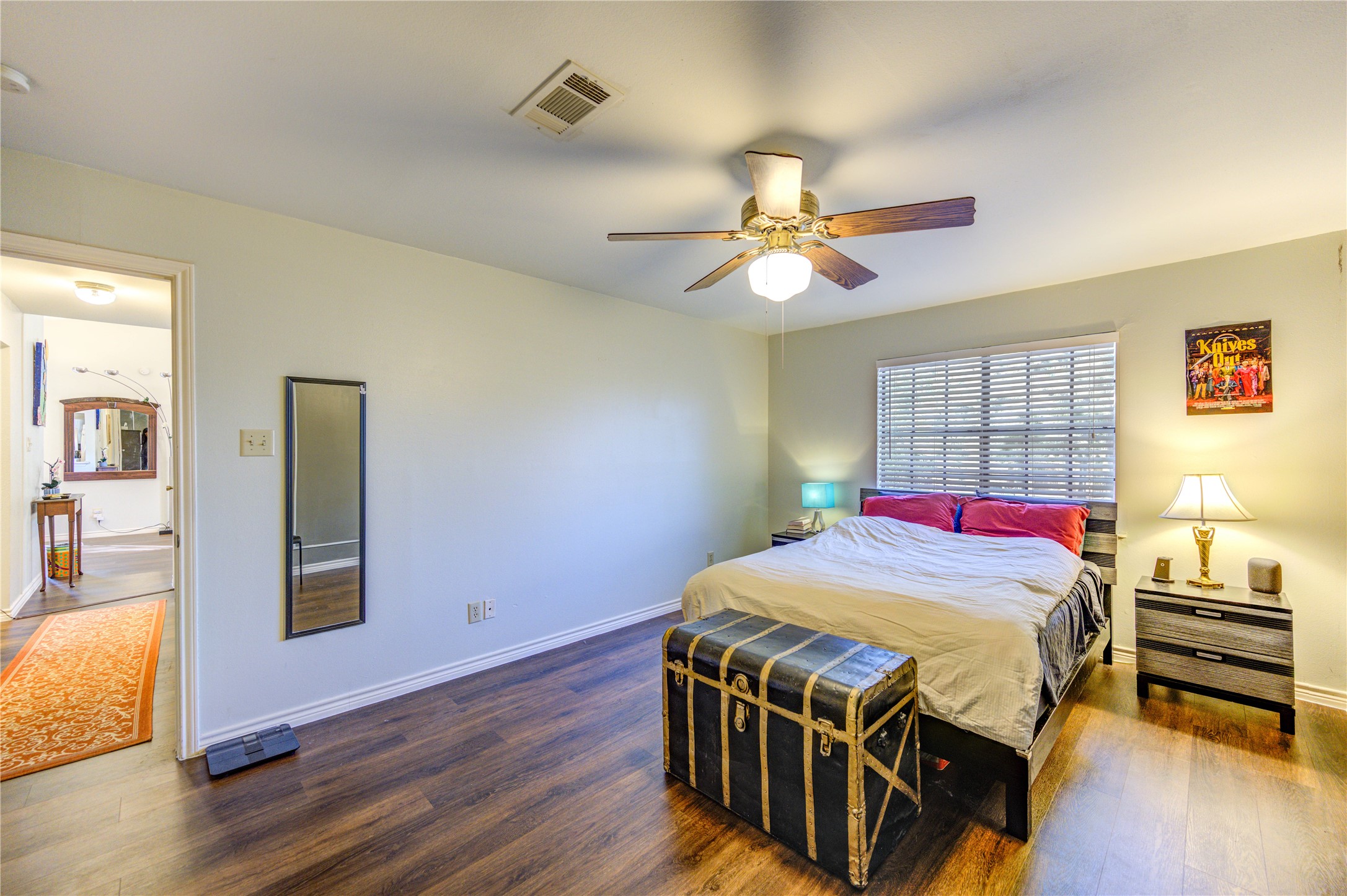 7861 Champion Pines Drive Spring, TX 77379 - Photo 24 of 34 a bedroom with a bed and wooden floor