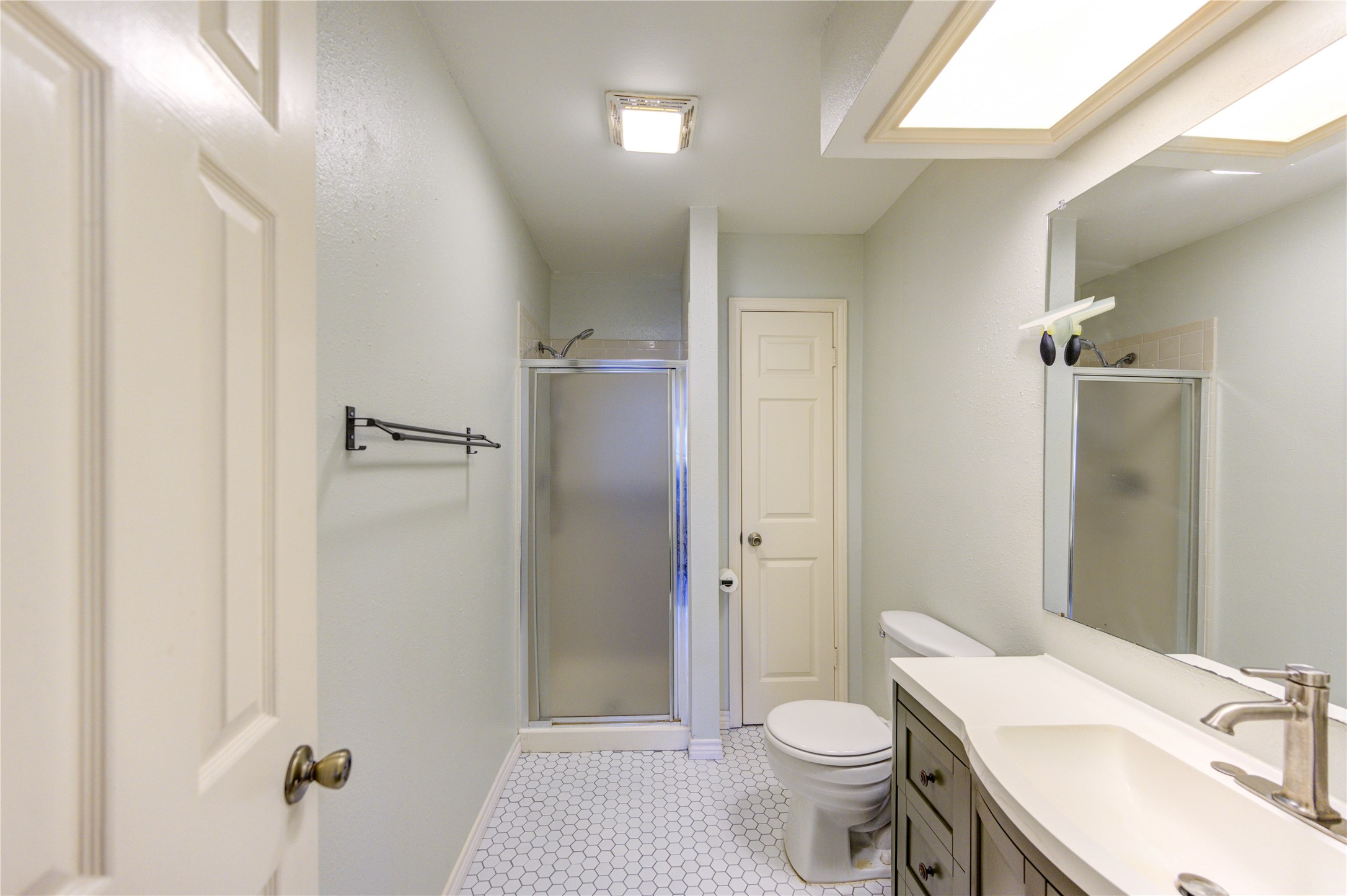 7861 Champion Pines Drive Spring, TX 77379 - Photo 27 of 34 a bathroom with a sink toilet and shower