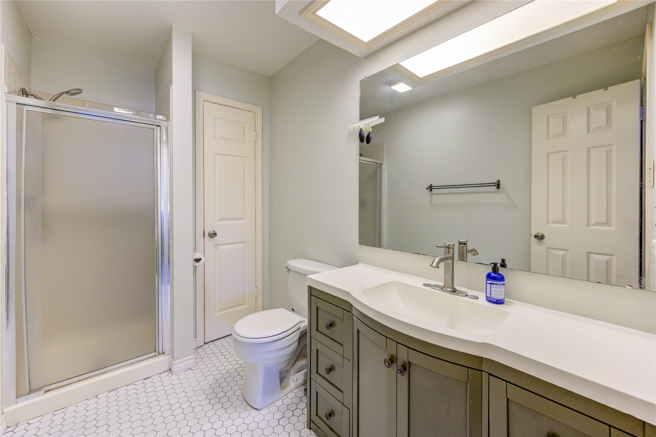 7861 Champion Pines Drive Spring, TX 77379 - Photo 28 of 34 a bathroom with a sink vanity mirror and toilet