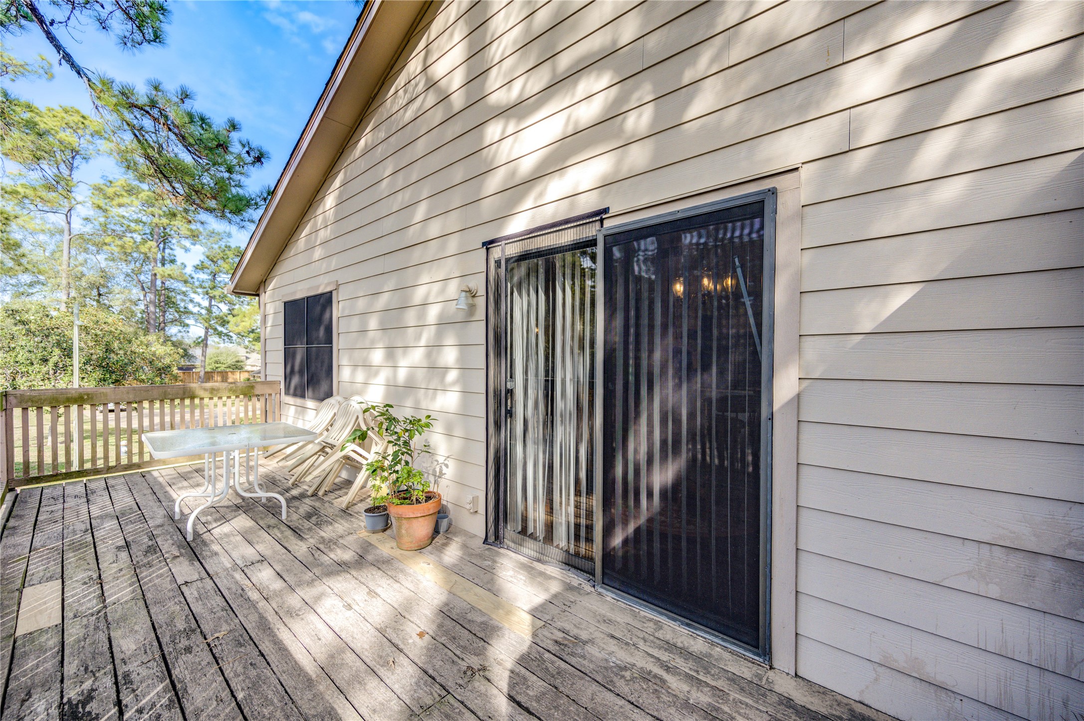 7861 Champion Pines Drive Spring, TX 77379 - Photo 3 of 34 a view of a house with wooden floor and wooden roof