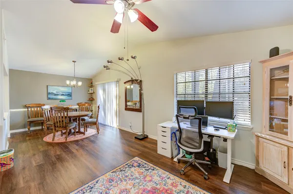 a workspace with furniture hardwood and a window