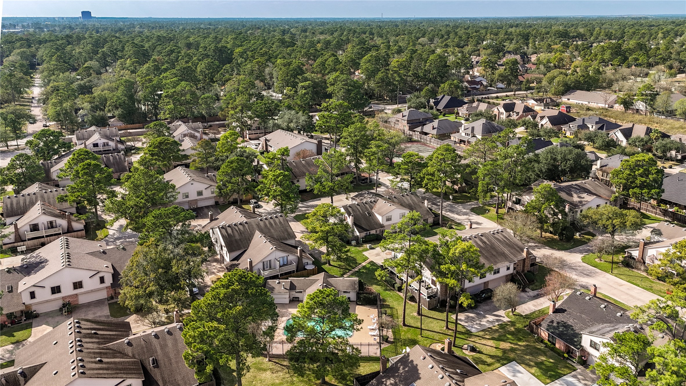 7861 Champion Pines Drive Spring, TX 77379 - Photo 32 of 34 an aerial view of residential houses with outdoor space and trees