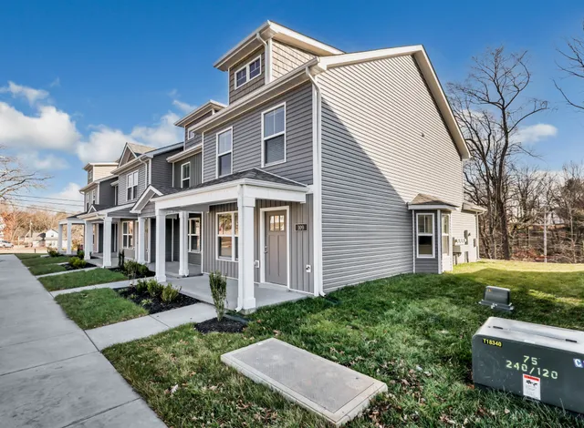 front view of a house with a yard