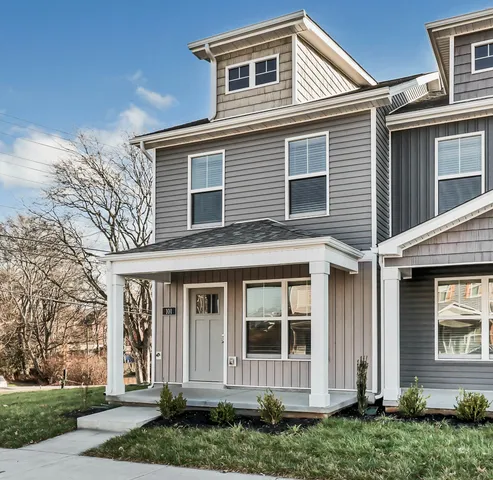 front view of a house with a yard