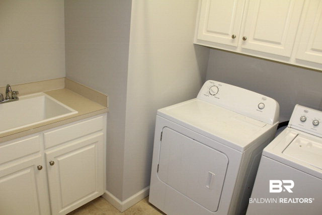 8643 Pine Run Daphne, AL 36527 - Photo 34 of 45 Utility Room with cabinets and a sink.