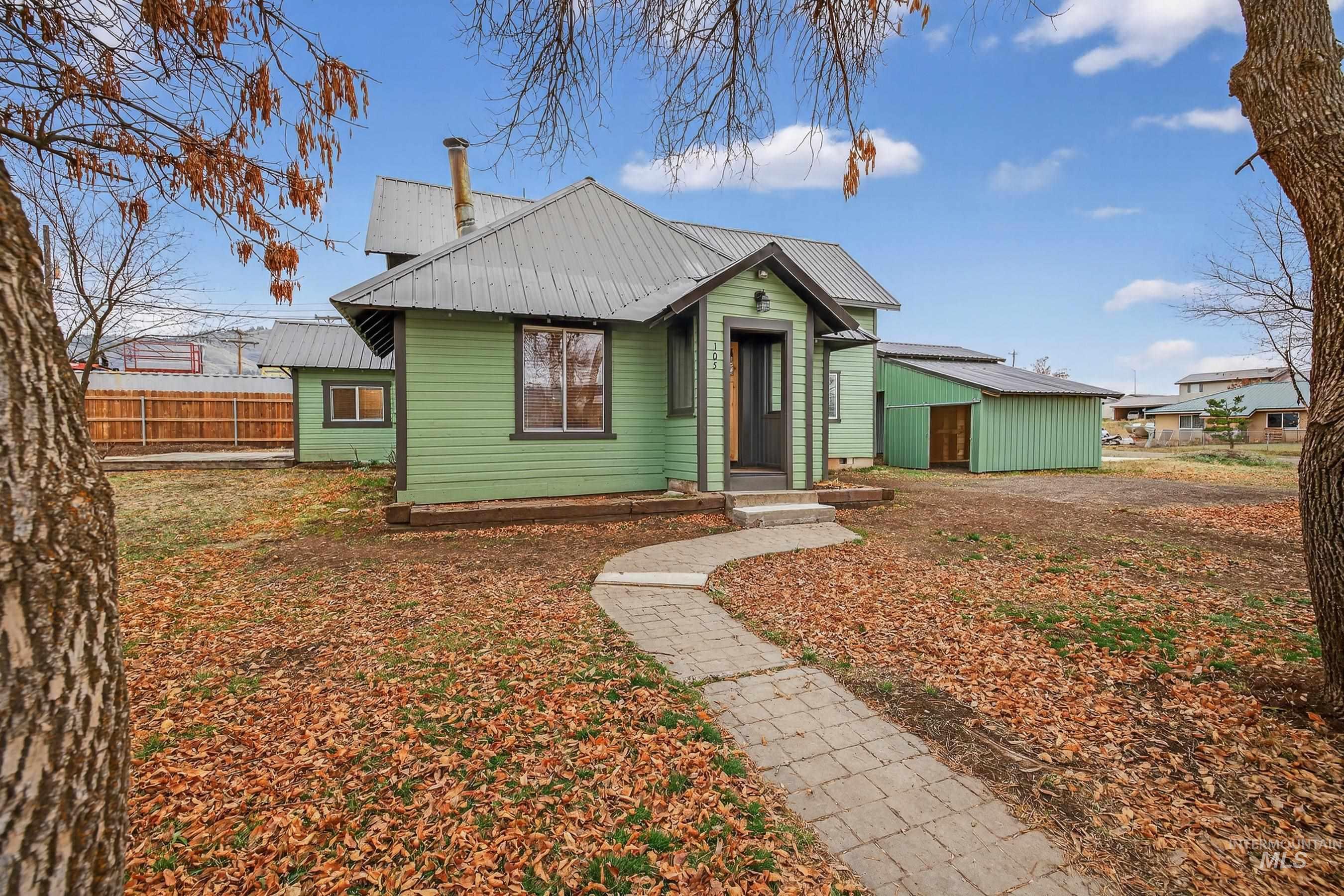 Bungalow-style home with a metal roof