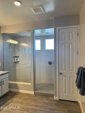 a bathroom with a tub and shower