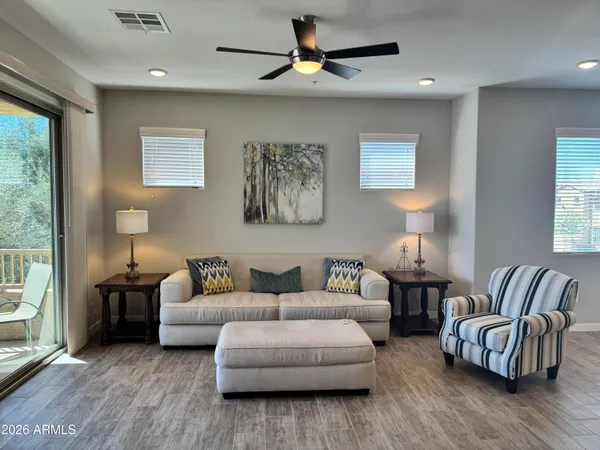 a living room with furniture and a large window