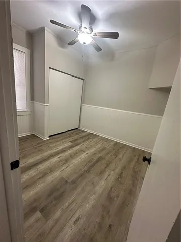 a view of a livingroom with wooden floor