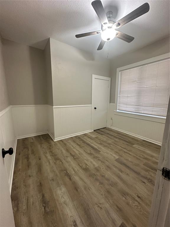 2523 West Spruce Street Tampa, FL 33607 - Photo 14 of 15 a view of a livingroom with a ceiling fan and window