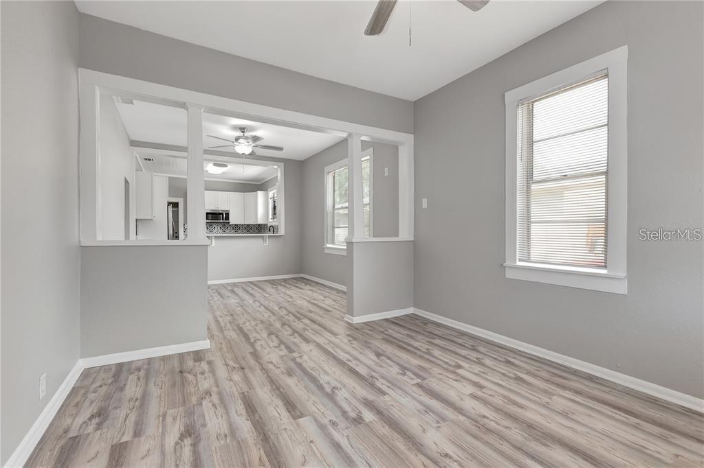 2523 West Spruce Street Tampa, FL 33607 - Photo 6 of 15 wooden floor in an empty room with a window