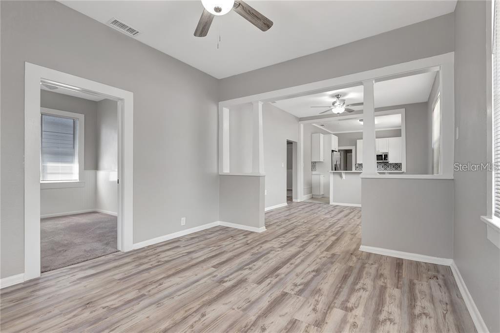 2523 West Spruce Street Tampa, FL 33607 - Photo 7 of 15 a view of a kitchen with wooden floor and a kitchen