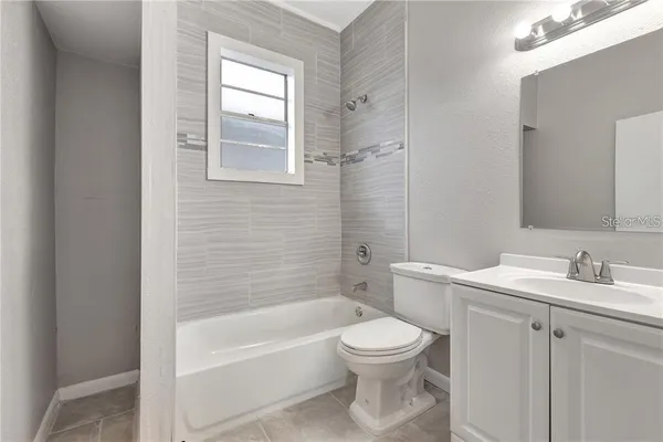 a bathroom with a sink toilet and bathtub