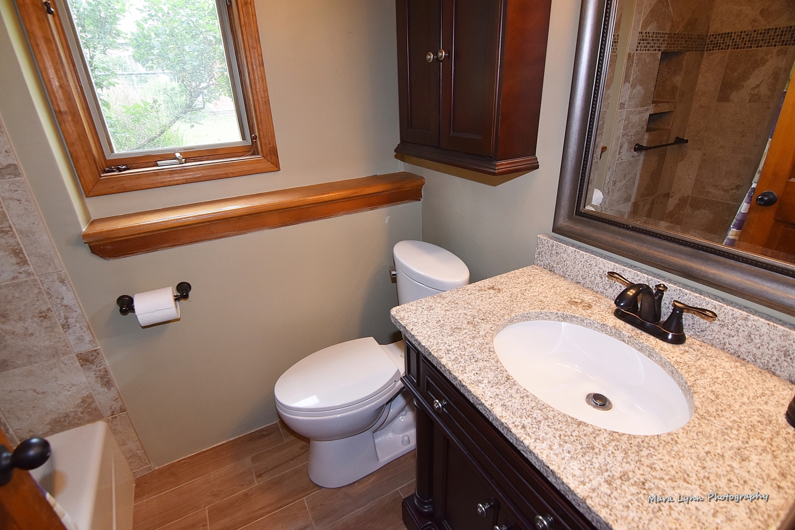 1424 Sunset Road Geneva, IL 60134 - Photo 15 of 38 a bathroom with a granite countertop toilet sink and mirror