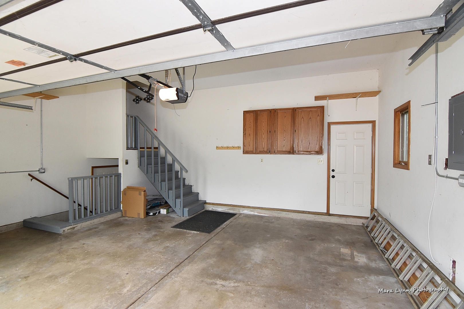 1424 Sunset Road Geneva, IL 60134 - Photo 32 of 38 a view of a hallway with staircase