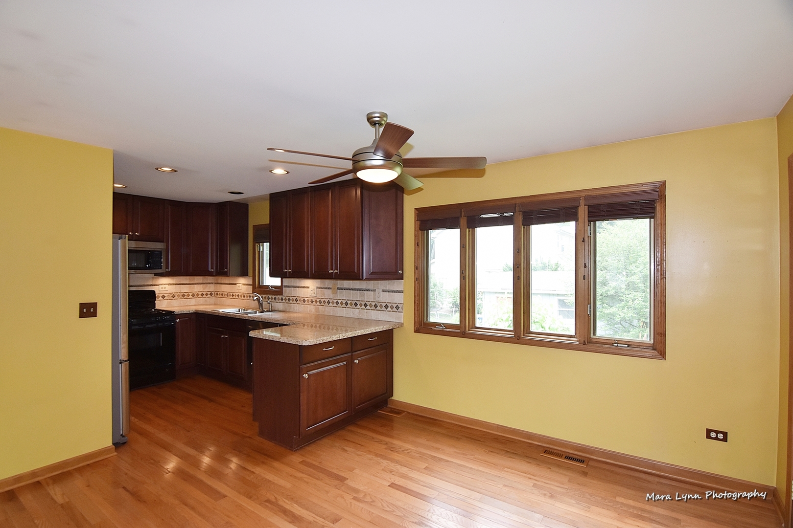 1424 Sunset Road Geneva, IL 60134 - Photo 5 of 38 a view of kitchen with granite countertop cabinets and outdoor space