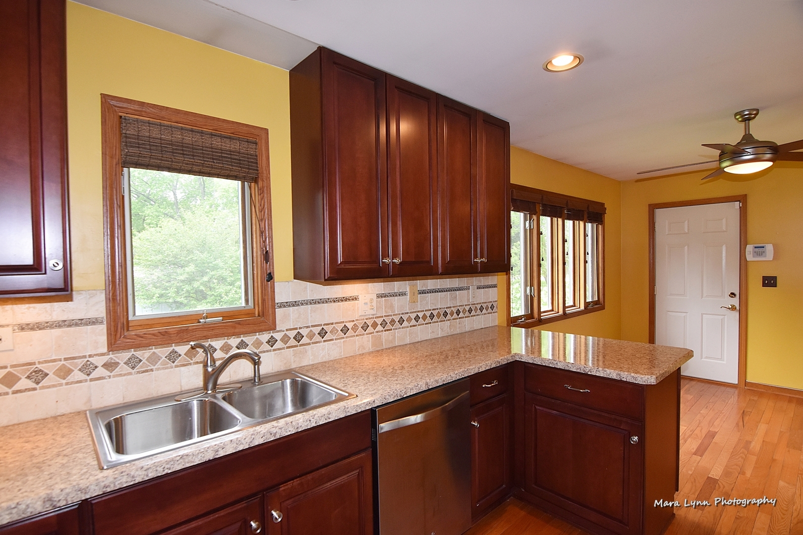 1424 Sunset Road Geneva, IL 60134 - Photo 7 of 38 a kitchen with a sink cabinets and window