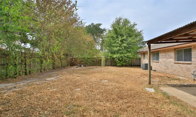 a backyard of a house with lots of green space