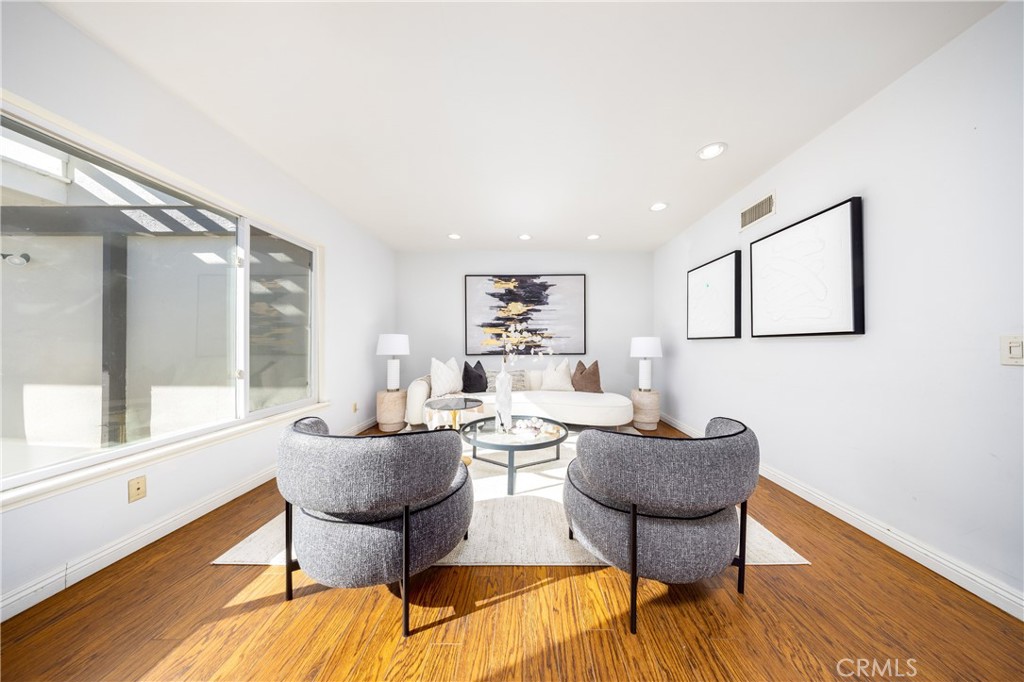 648 Sharon Road Arcadia, CA 91007 - Photo 11 of 26 a living room with furniture and a wooden floor